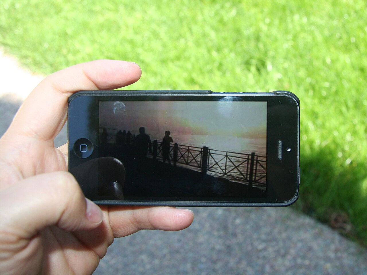 A person watching video on a smartphone