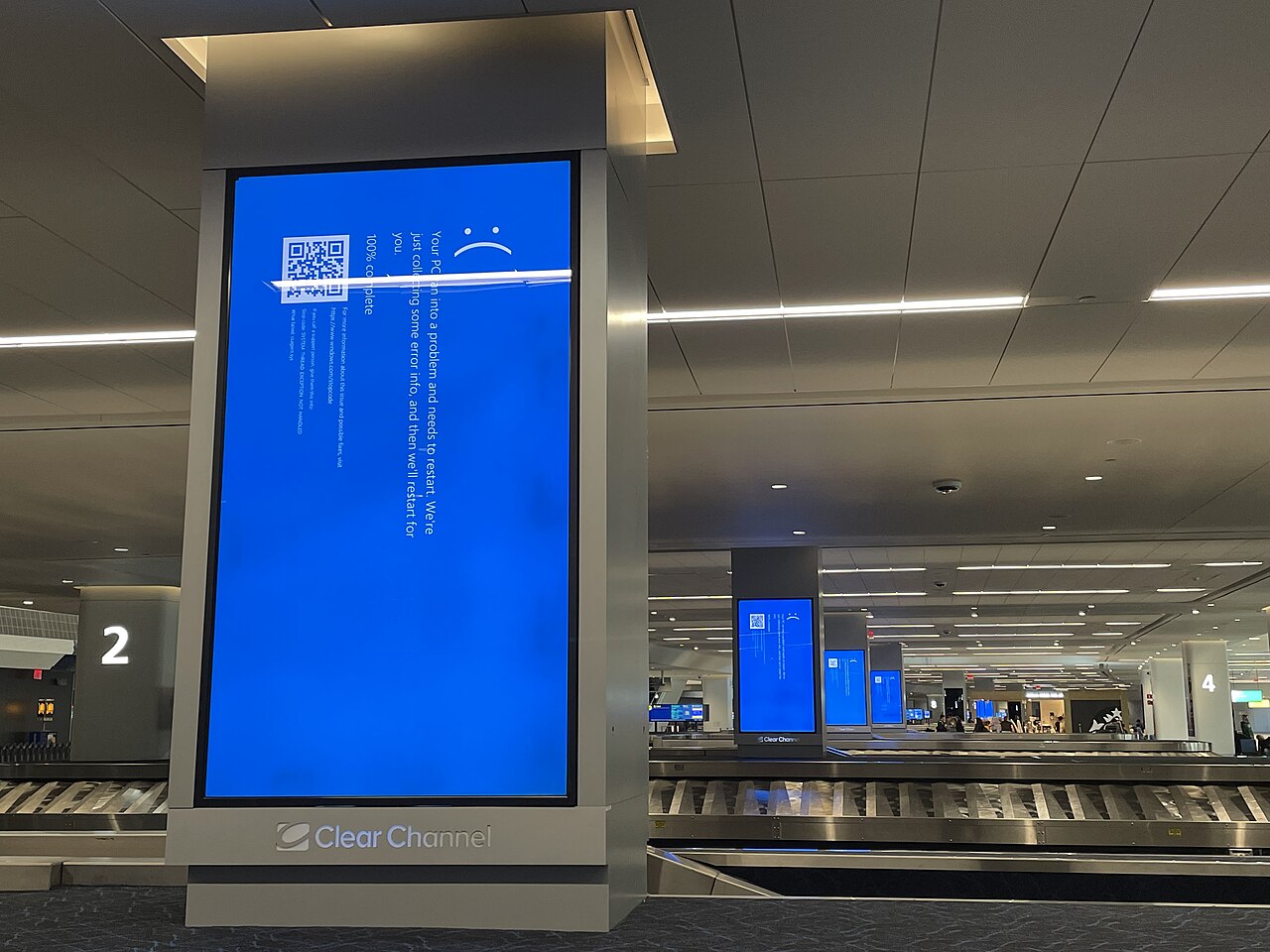 Departure screens at LaGuardia airport showing the Windows blue screen of death during the CrowdStrike outage