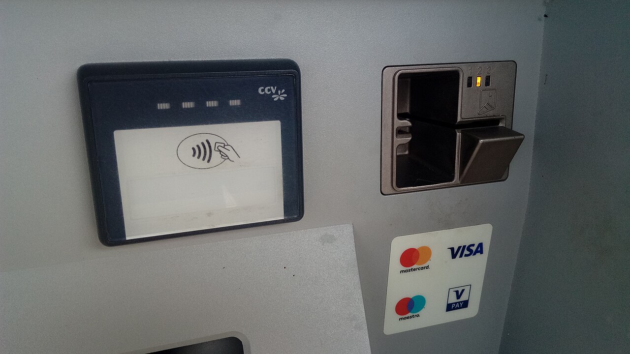 A card payment terminal showing contactless and chip-and-PIN slots, with Visa and Mastercard stickers